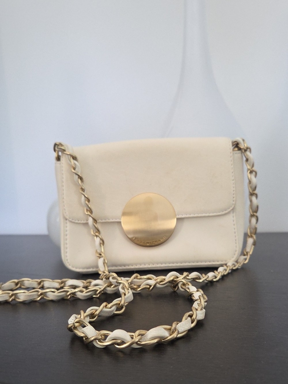 Isaac Mizrahi Leather Cream Crossbody with Gold Medallion